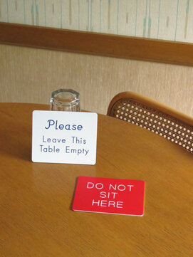 Leave this table empty signs do not occupy this table Do not sit here signs