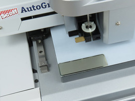 The metal name tag adheres to engraving machine bed. The metal name tag adheres to engraving machine bed.